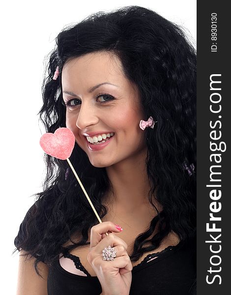 Beautiful lady holding a heart lollipop. Beautiful lady holding a heart lollipop.