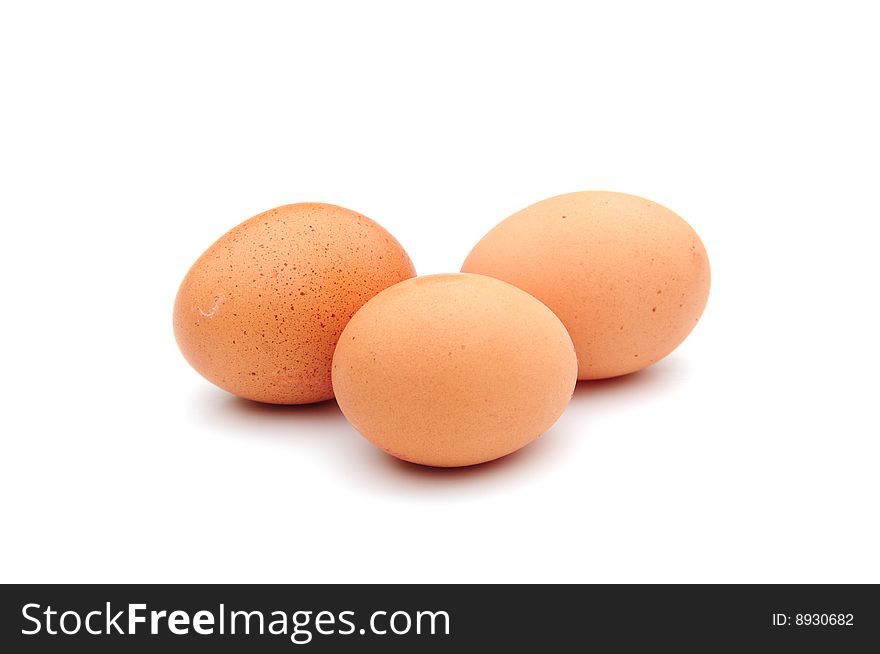 Shot of three fresh eggs on white