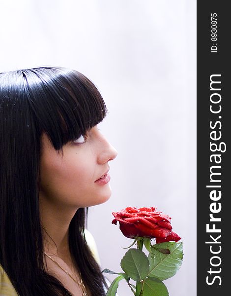 Girl with beautiful flower - red rose. Girl with beautiful flower - red rose