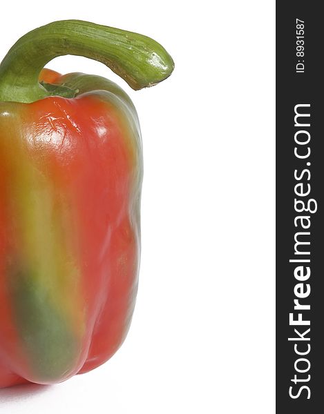 Single multi-colored - green and red pepper on white background. Horizontal image with clipping path and copy-space. Single multi-colored - green and red pepper on white background. Horizontal image with clipping path and copy-space.