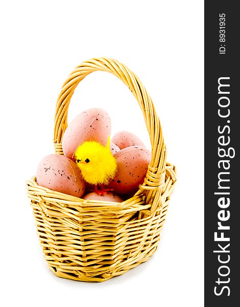 Small basket with eggs and a eastern chicken