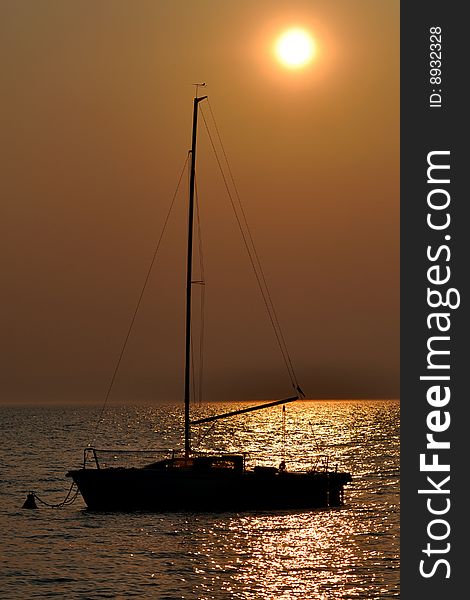 A Boat silhouette at sunset. A Boat silhouette at sunset