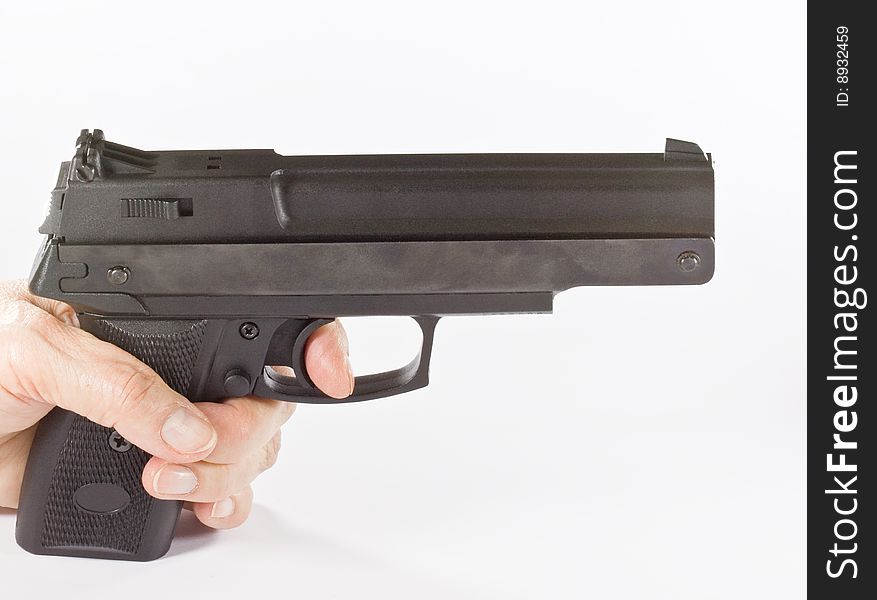 Pistol In Hand On White Background