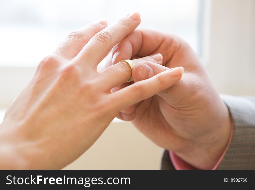 Wearing wedding ring to female finger. Wearing wedding ring to female finger