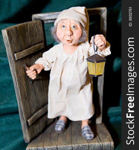 Hand made lamplighter doll on green ground
