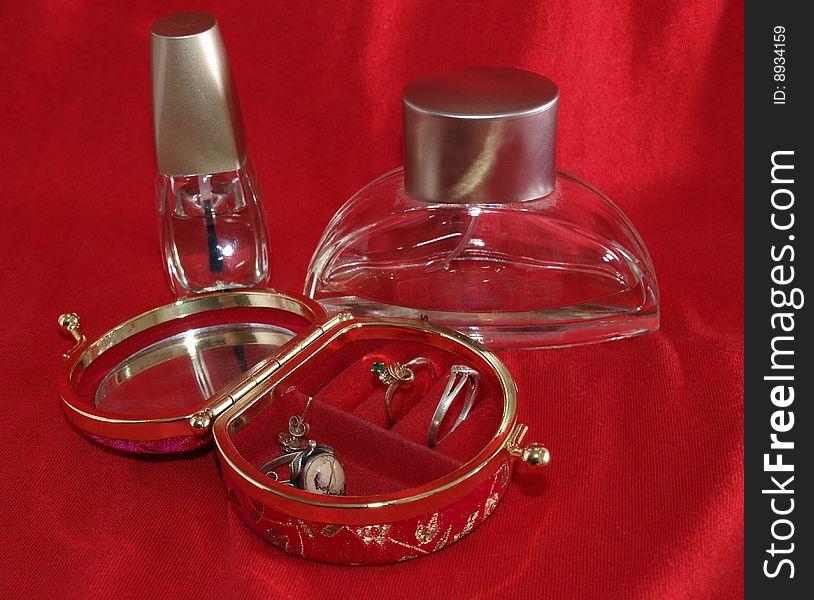 Color photo of table in the women's make-up room. bottle of perfume and nail varnish. Color photo of table in the women's make-up room. bottle of perfume and nail varnish.