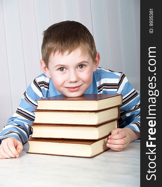 The child with books on the table