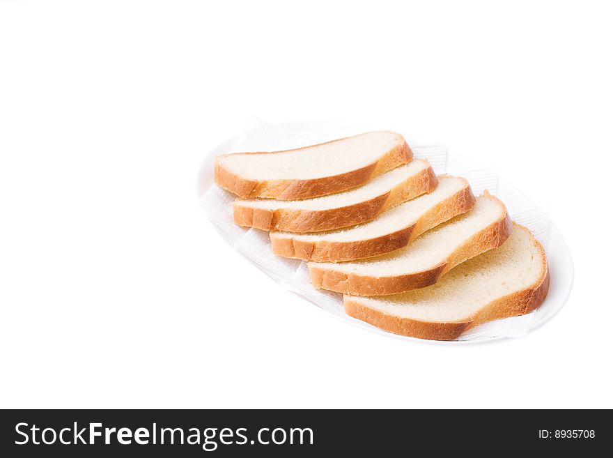 Sliced Bread on the plate isolated over white. Bon appetit!. Sliced Bread on the plate isolated over white. Bon appetit!