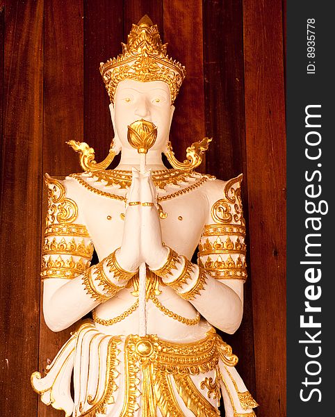Deva statue in traditional Thai style of Wat Ming Maung, Chaing Rai province, north of Thailand. Deva statue in traditional Thai style of Wat Ming Maung, Chaing Rai province, north of Thailand