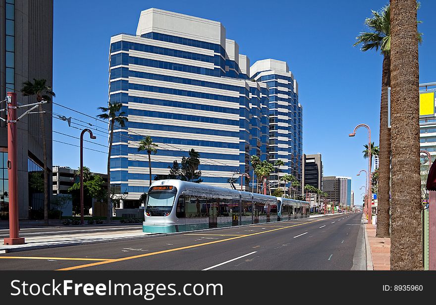 Street with sky scrapers, and light rail. Street with sky scrapers, and light rail.