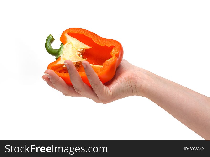 Cut bulgarian pepper on palm insulated on white background