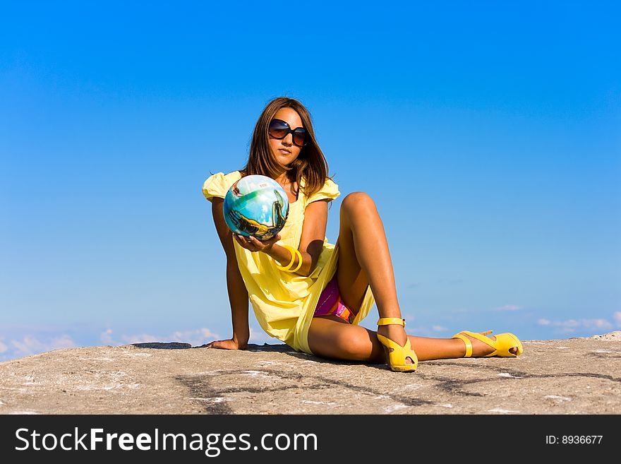Swarthy young girl poses on the beach