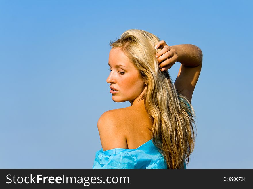 Gorgeous blond woman posing in a beach. Gorgeous blond woman posing in a beach