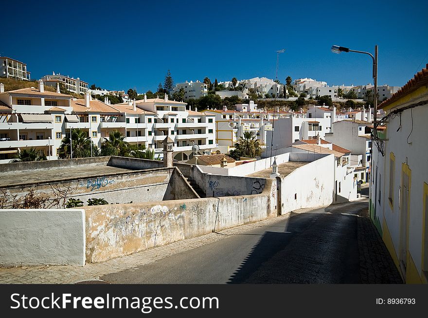 Houses and road in Portuguise town. Houses and road in Portuguise town