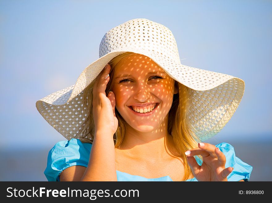 Young girl under hat in summer. Young girl under hat in summer