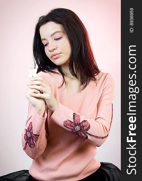 Fashion girl in pink with little flower