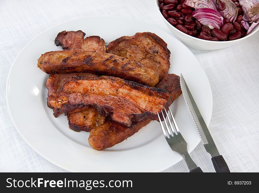 Fried lunch with roasted bacon,sausage,cutlet