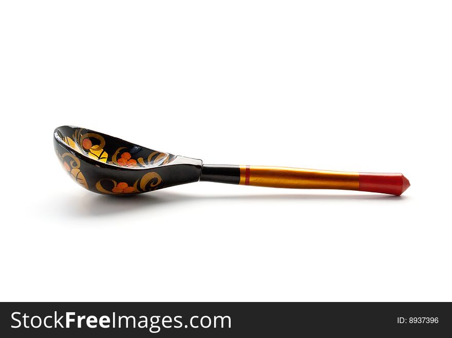 Russian wooden spoon on the white background. Russian wooden spoon on the white background