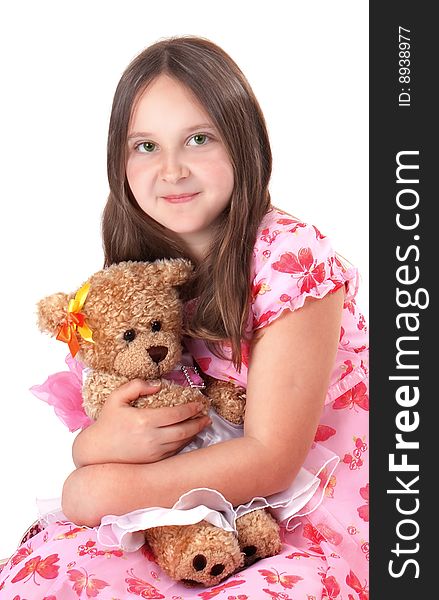 Girl in pink hat and dress with her teddy. Girl in pink hat and dress with her teddy