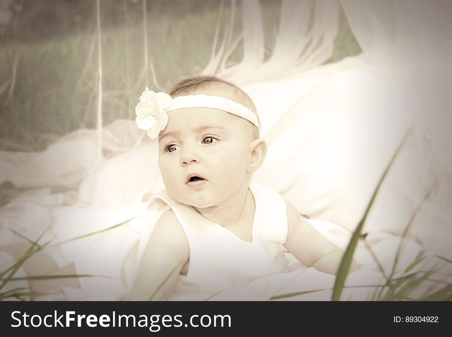 Baby in White Tank Dress and Headband