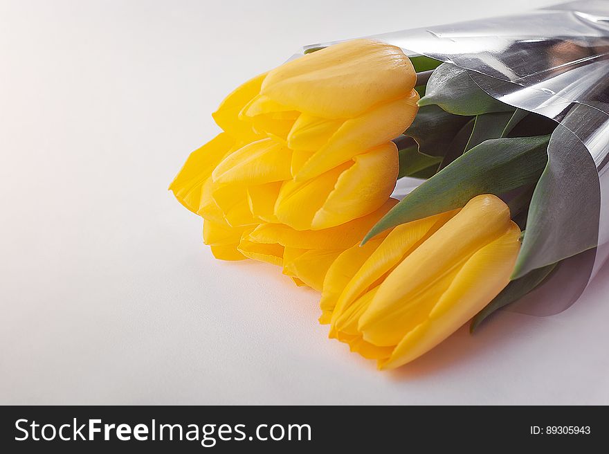 A close up of a yellow tulip bouquet.