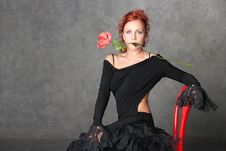The Charming Girl With A Red Rose Stock Image