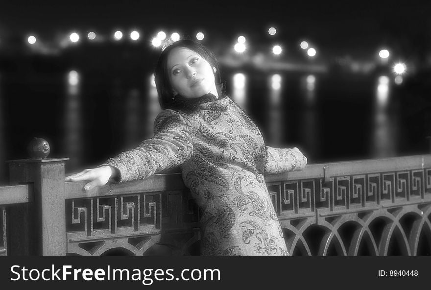 Black and white photo. Portrait of young lonely woman in soft focus. Black and white photo. Portrait of young lonely woman in soft focus.