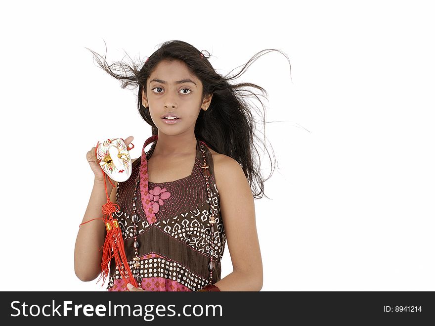 Beautiful girl holding mask over white background. Beautiful girl holding mask over white background