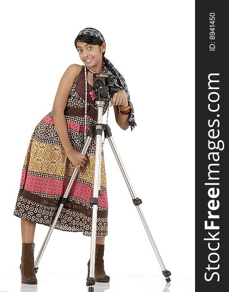 Beautiful girl standing with tripod wearing scarf and necklace. Beautiful girl standing with tripod wearing scarf and necklace