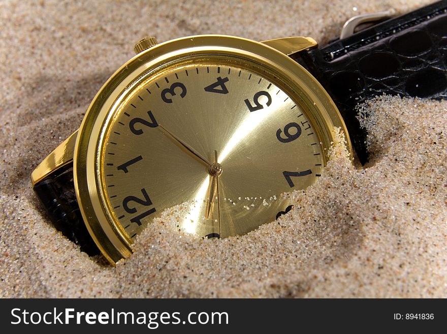 Clock on sand bacground