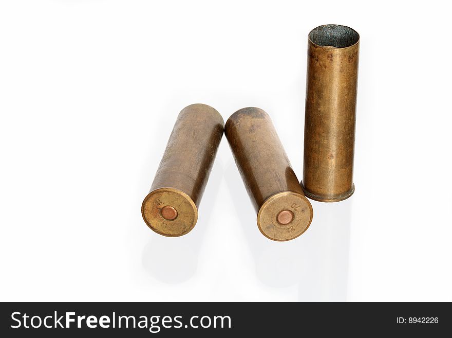 Three old brass cartridges for fowling piece isolated on white background. Three old brass cartridges for fowling piece isolated on white background