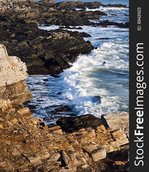 Coast of Maine in morning light over the rocks and jagged coast