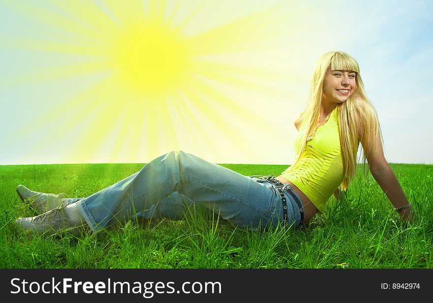 Happy beauty young woman jump in field with green grass