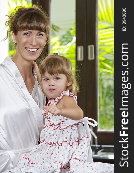 Portrait of beautiful young woman with her daughter. Portrait of beautiful young woman with her daughter