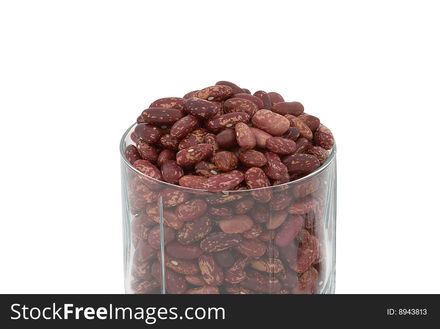 Haricot beans in the transparent glass isolated over white