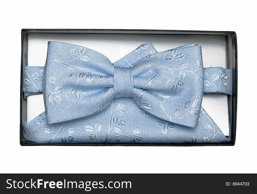 Blue tie-butterfly with patterns and a shawl in a gift box, it is isolated. Blue tie-butterfly with patterns and a shawl in a gift box, it is isolated