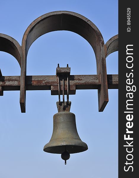 Bell on a metal arch a symbol religion a signal
