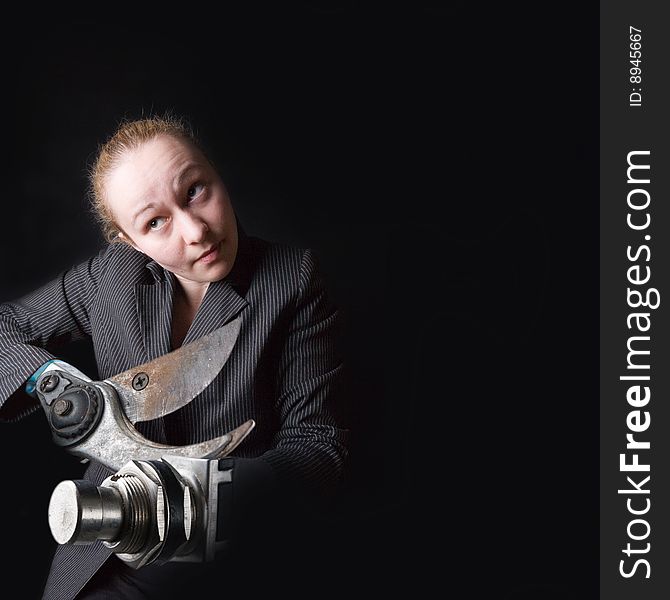 Female with gun instead of hands against the black background. Female with gun instead of hands against the black background