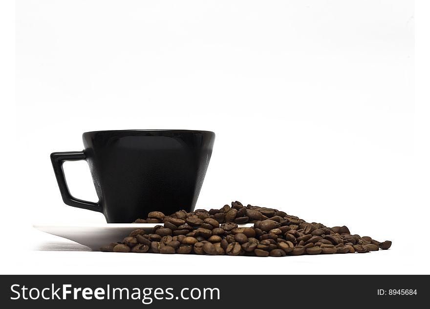 A lovely set of a coffee mug and coffee beads, isolated on a white background.