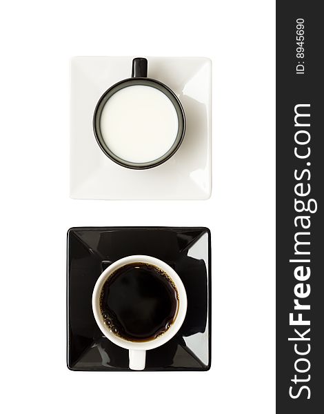 A lovely set of a black and white coffee mug, isolated on a white background, viewed from above.