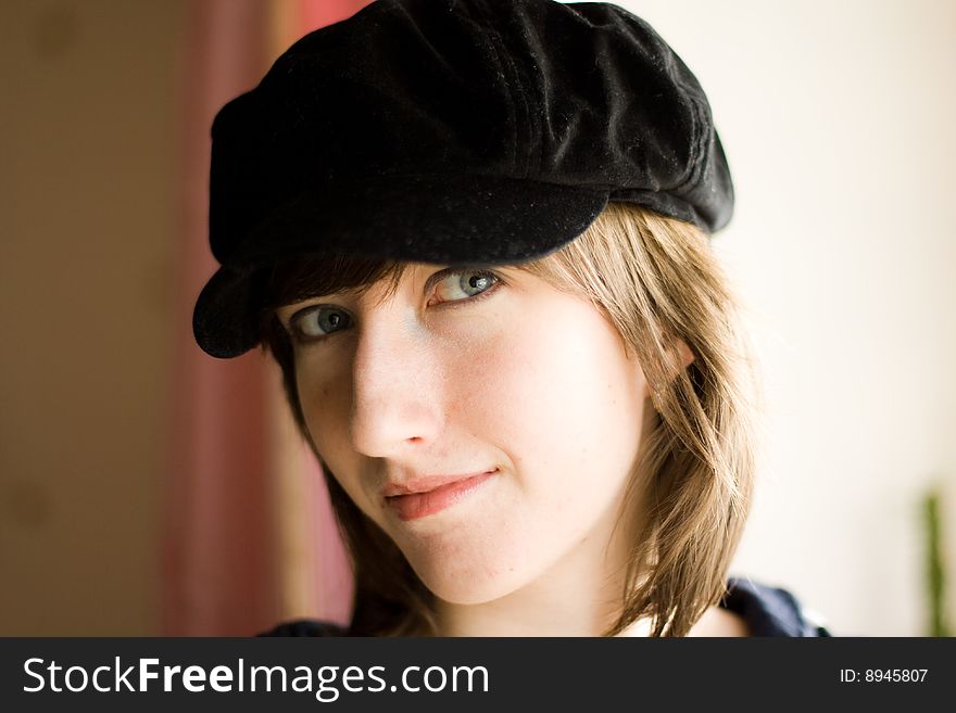 Beautiful girl in a stylish black cap. Beautiful girl in a stylish black cap