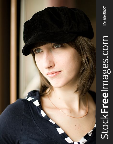 Beautiful girl in a stylish black cap. Beautiful girl in a stylish black cap