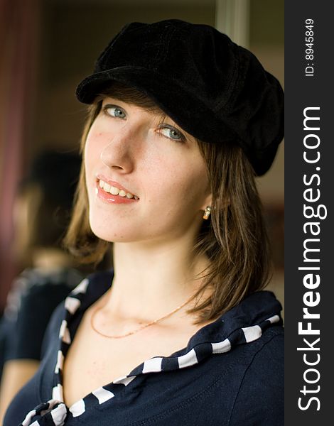 Beautiful girl in a stylish black cap. Beautiful girl in a stylish black cap