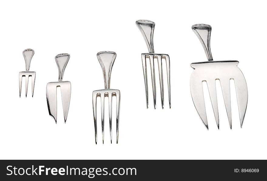 Silver forks set setout on a white background. With clipping path.
