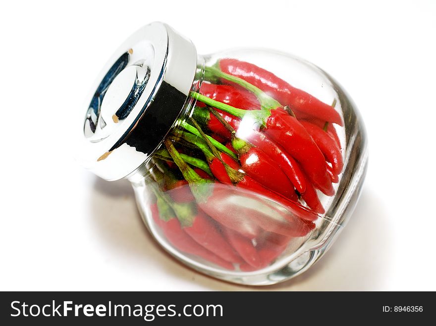 Close up capture red spicy chili on white background. Close up capture red spicy chili on white background