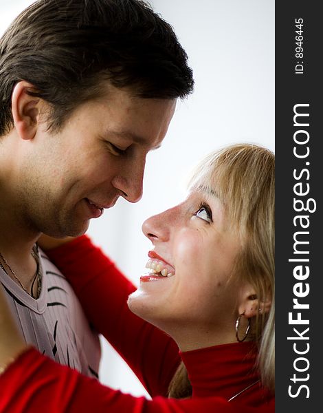 Happy young couple is happy. The girl and the young man are smiling. Happy young couple is happy. The girl and the young man are smiling.