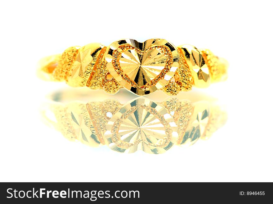 Close up of a golden ring isolated on white background.