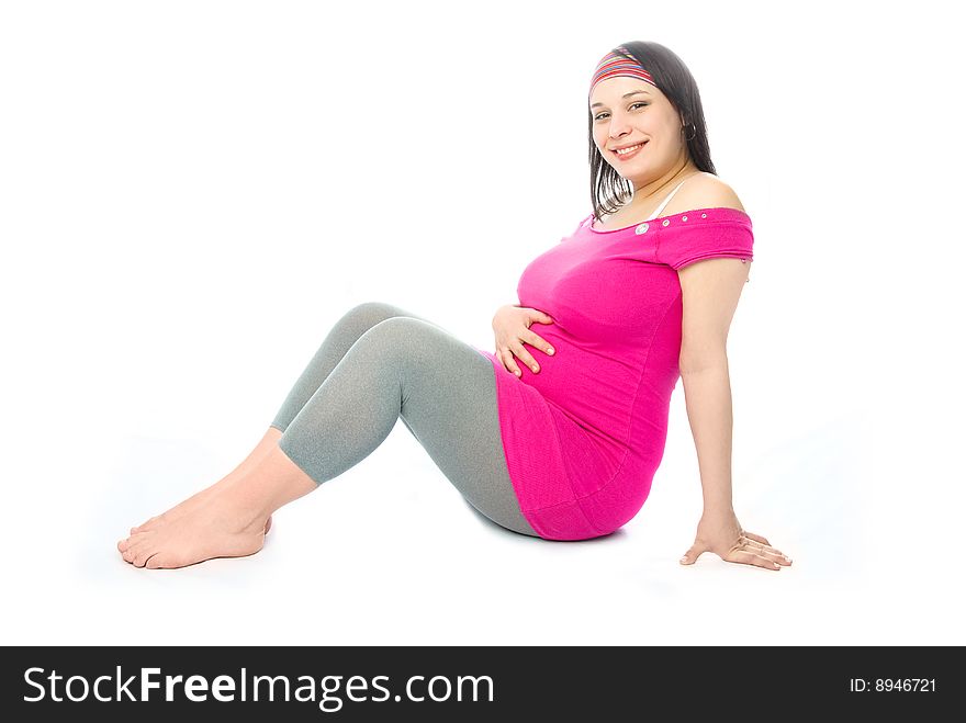 Portrait of a happy beautiful pregnant woman sitting on the floor. Portrait of a happy beautiful pregnant woman sitting on the floor