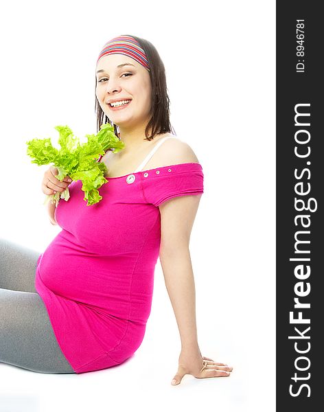 Pregnant woman eating salad