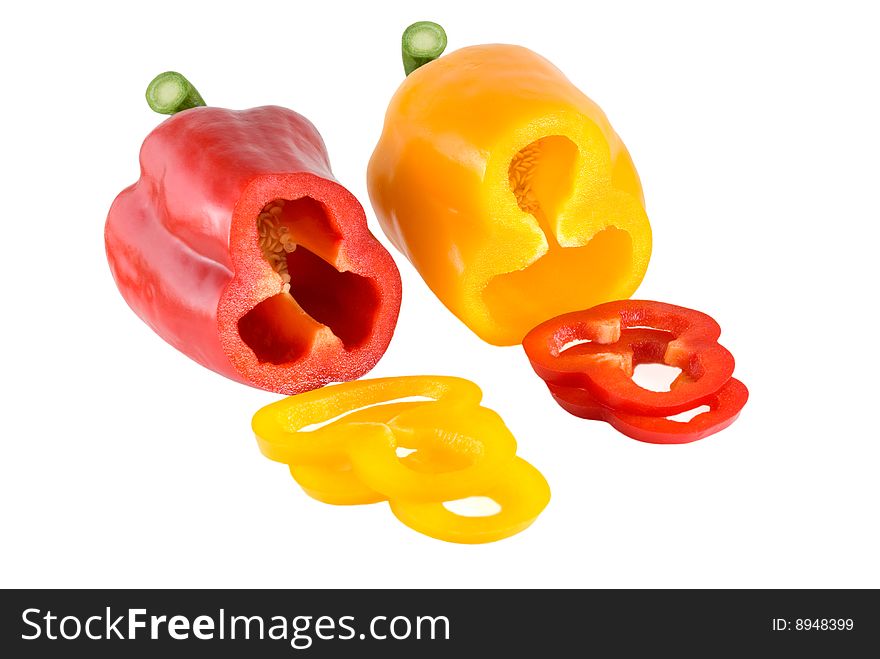 Red and yellow sweet pepper are photographed on the white background. Red and yellow sweet pepper are photographed on the white background